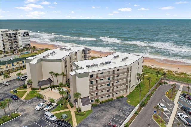 aerial view featuring a water view and a beach view