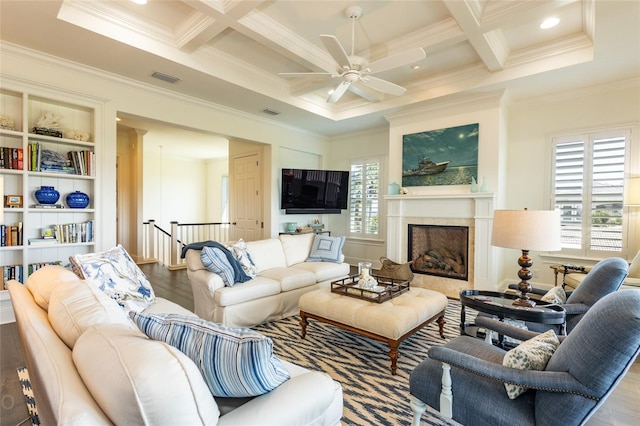 living room with ornamental molding, light wood-type flooring, coffered ceiling, and beam ceiling