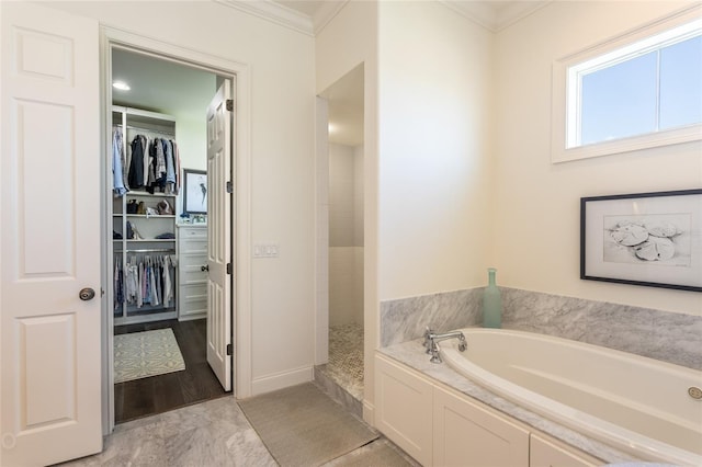 bathroom with hardwood / wood-style flooring, independent shower and bath, and crown molding