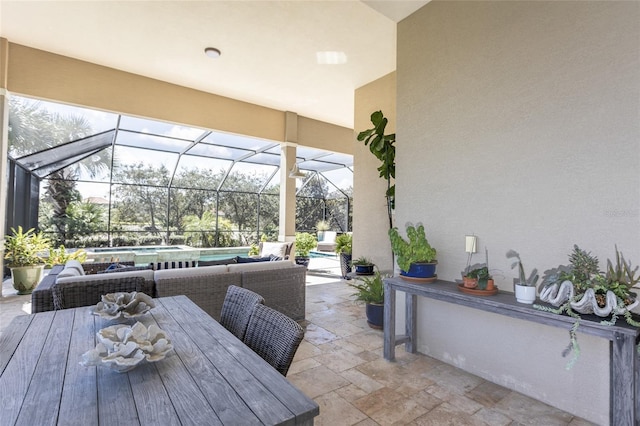 view of patio featuring a lanai and an outdoor living space