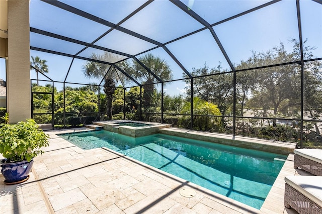 view of pool featuring a lanai, a patio area, and an in ground hot tub