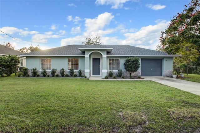 ranch-style home featuring a garage and a front yard