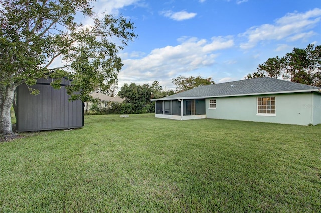 view of yard with a shed and a sunroom