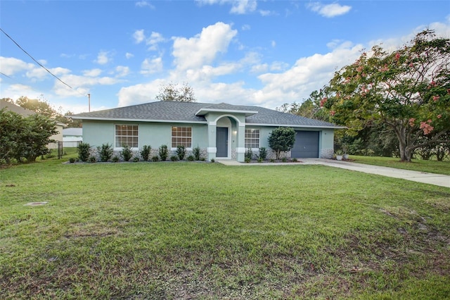 ranch-style home featuring a garage and a front lawn