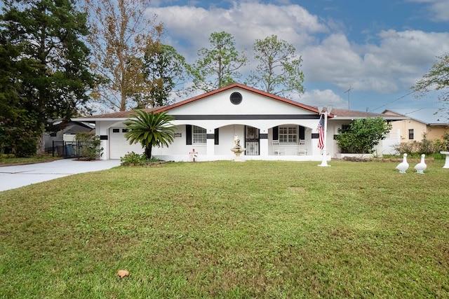 ranch-style house featuring covered porch, a garage, and a front lawn