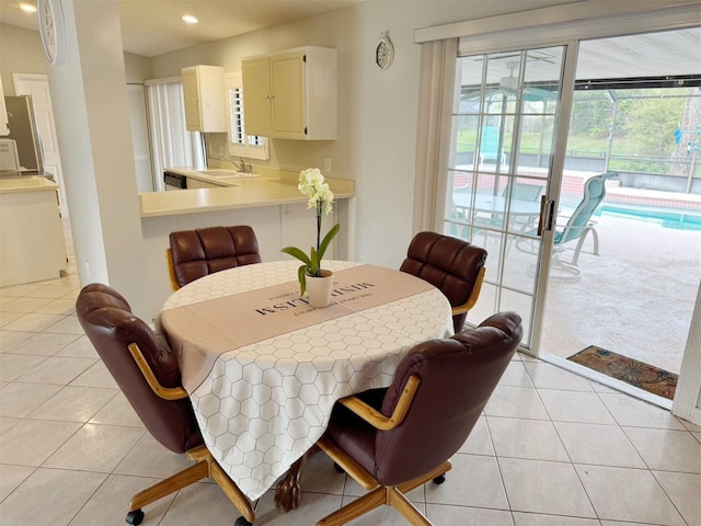 dining room featuring light tile patterned floors and sink