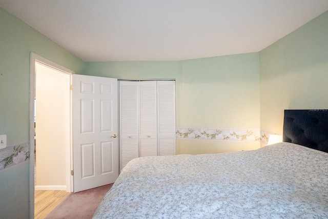 bedroom with a closet and light wood-type flooring