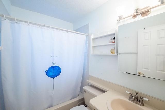 full bathroom featuring shower / bath combo, vanity, a textured ceiling, and toilet