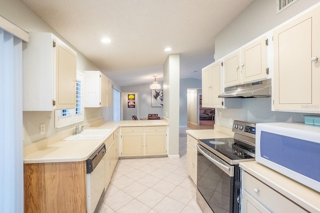 kitchen featuring vaulted ceiling, sink, light tile patterned floors, and white appliances