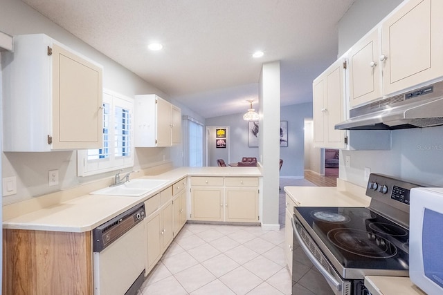 kitchen with sink, white dishwasher, vaulted ceiling, stainless steel electric stove, and light tile patterned flooring