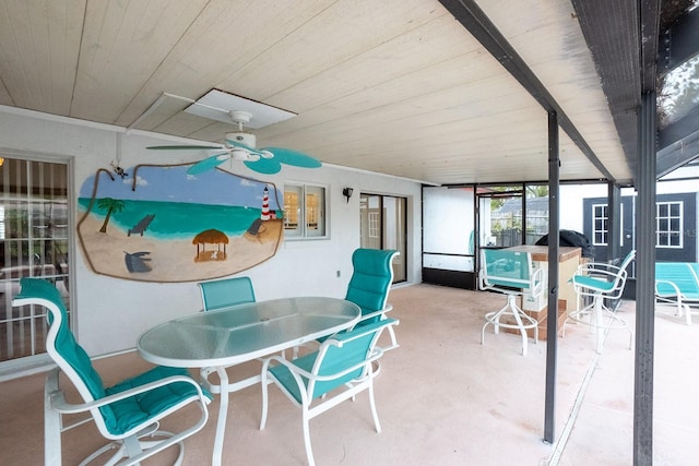 sunroom / solarium with plenty of natural light, wooden ceiling, and ceiling fan