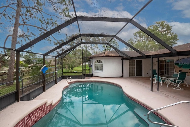 view of pool featuring a patio area and a lanai