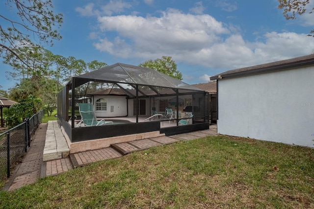 view of yard featuring a pool, a lanai, and a patio area