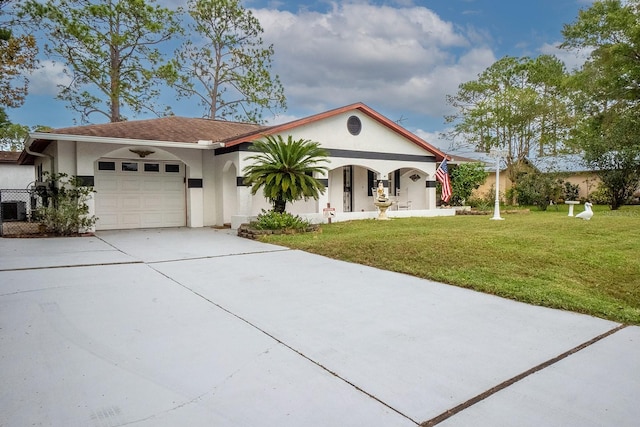 view of front of property with a garage and a front yard