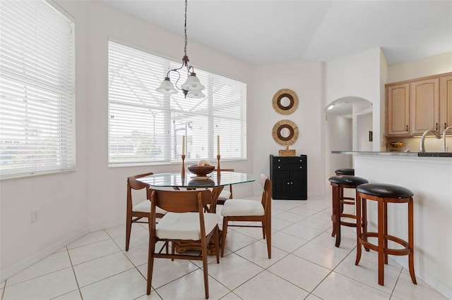 dining space featuring light tile patterned flooring