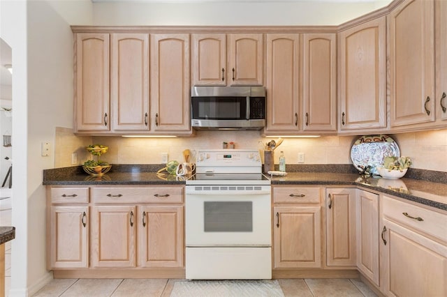 kitchen with white electric range, light brown cabinets, tasteful backsplash, and light tile patterned floors