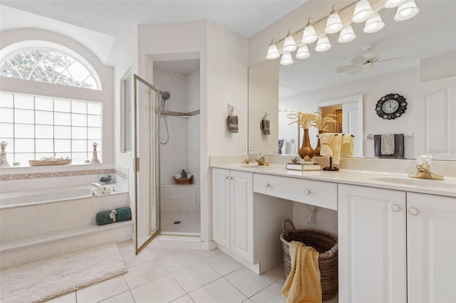 bathroom with tile patterned floors, ceiling fan, vanity, and independent shower and bath