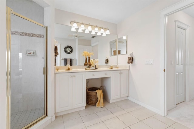 bathroom with tile patterned flooring, vanity, ceiling fan, and a shower with shower door