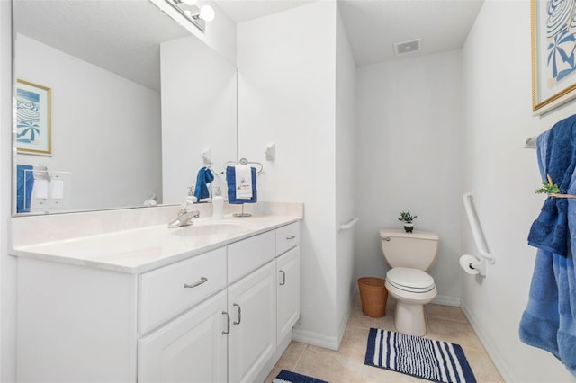 34 Clermont Ct, Palm Coast, FL 32137 - bathroom featuring vanity, toilet, tile patterned flooring, and baseboards
