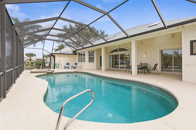 34 Clermont Ct, Palm Coast, FL 32137 - view of swimming pool featuring a patio area, a ceiling fan, a pool with connected hot tub, and glass enclosure