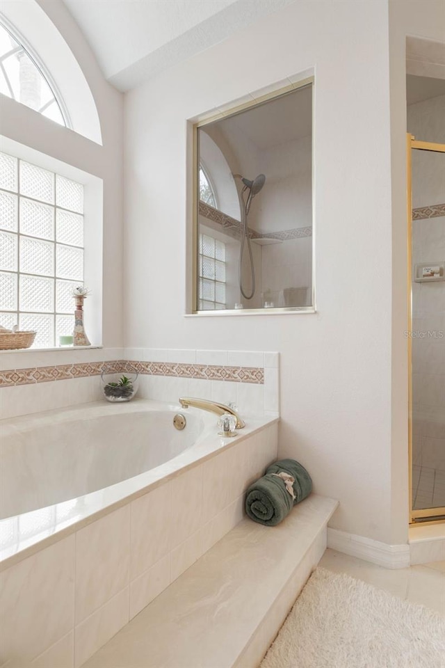 34 Clermont Ct, Palm Coast, FL 32137 - full bath featuring healthy amount of natural light, a stall shower, and a garden tub