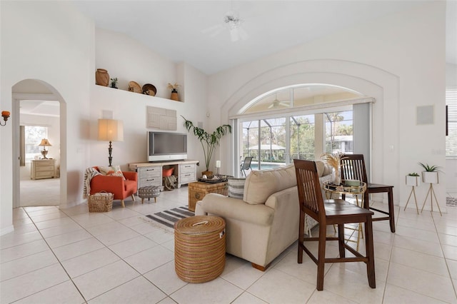 living room with light tile patterned floors and ceiling fan