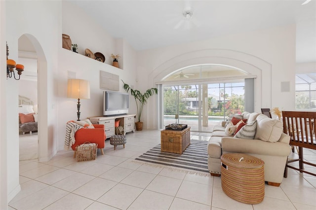 living room featuring a wealth of natural light and light tile patterned flooring