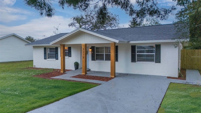 single story home featuring a porch and a front yard