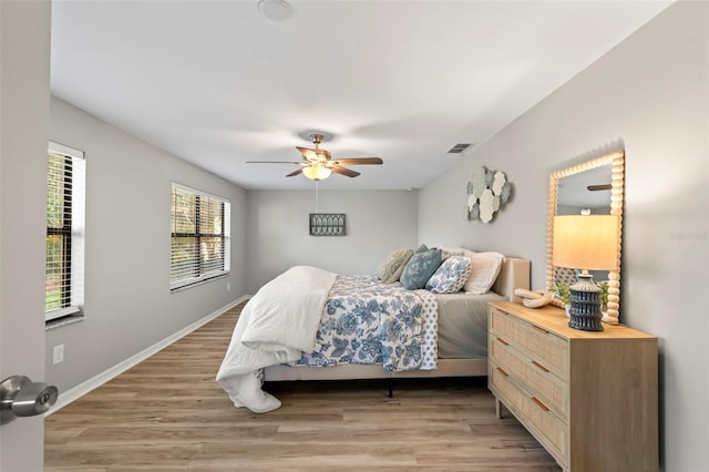 bedroom featuring light wood-type flooring and ceiling fan