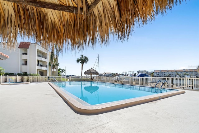 view of pool with a water view