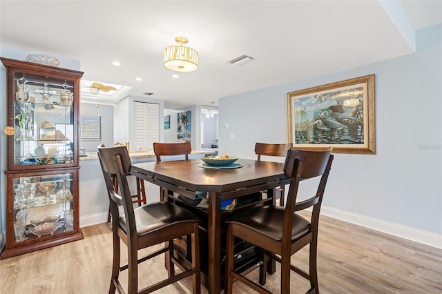 dining area with light hardwood / wood-style flooring