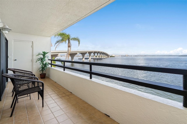 balcony featuring a water view