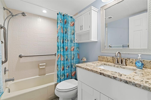 full bathroom with vanity, shower / bath combination with curtain, and toilet