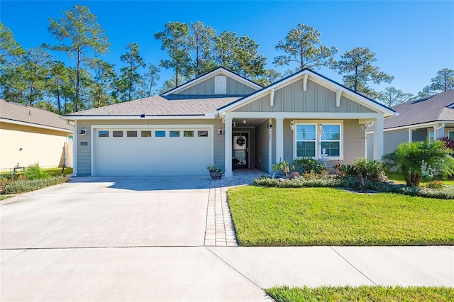 view of front facade with a front yard and a garage