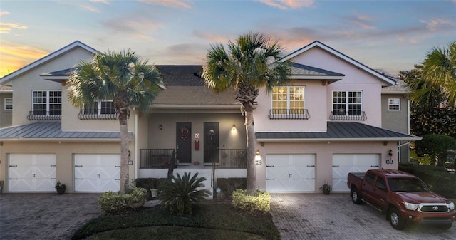 view of front of property with a garage