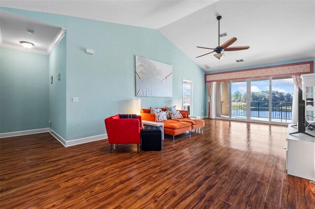 living room featuring dark hardwood / wood-style flooring, vaulted ceiling, ornamental molding, and ceiling fan