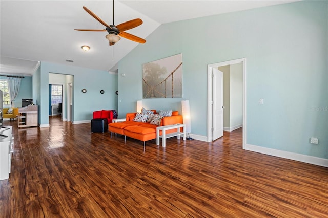 living area featuring hardwood / wood-style flooring, ceiling fan, and high vaulted ceiling