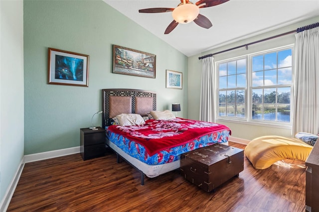 bedroom featuring ceiling fan, lofted ceiling, and dark hardwood / wood-style flooring