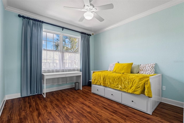 bedroom featuring ceiling fan, crown molding, dark hardwood / wood-style floors, and a textured ceiling