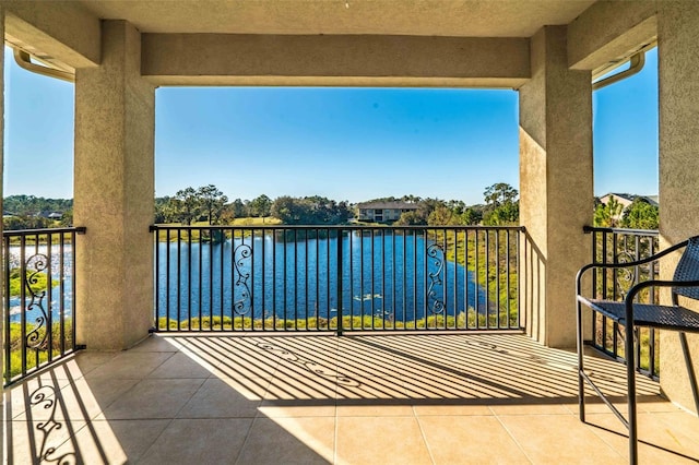 balcony featuring a water view