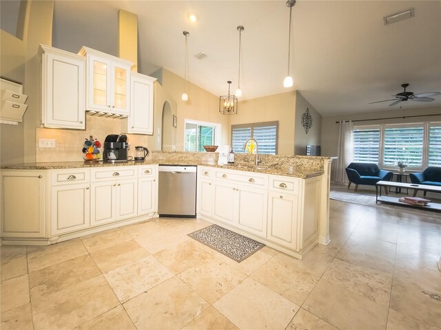 kitchen with kitchen peninsula, stainless steel dishwasher, ceiling fan with notable chandelier, sink, and hanging light fixtures