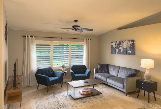 living room featuring vaulted ceiling and ceiling fan