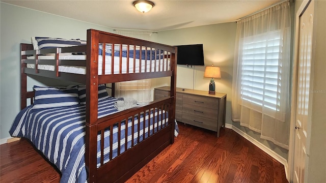 bedroom featuring dark hardwood / wood-style flooring