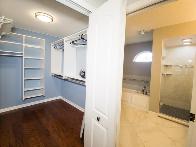 walk in closet featuring hardwood / wood-style flooring