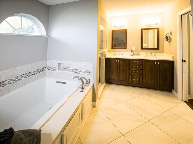 32 Woodward Ln, Palm Coast, FL 32164 - full bathroom with double vanity, a bath, and marble finish flooring