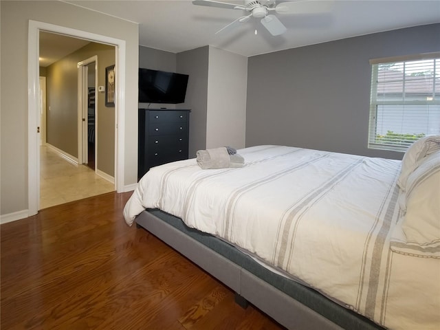 bedroom featuring ceiling fan and hardwood / wood-style floors