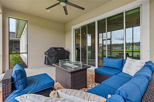 view of patio featuring an outdoor living space, area for grilling, and ceiling fan