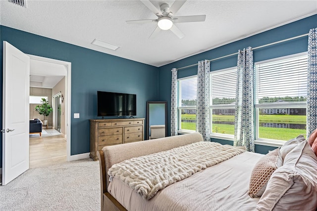 597 Mosaic Blvd, Daytona Beach, FL 32124 - bedroom with a textured ceiling, carpet floors, a ceiling fan, and baseboards