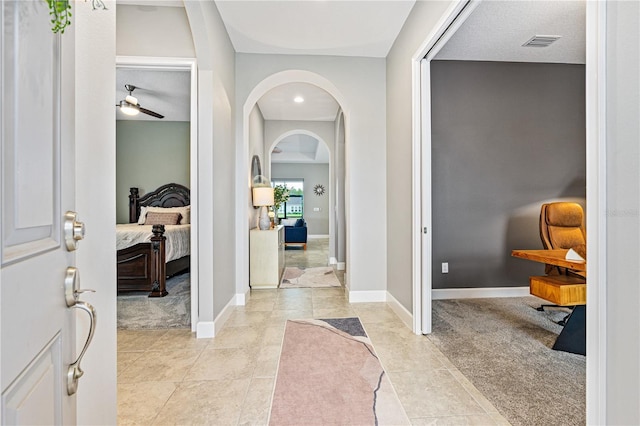 597 Mosaic Blvd, Daytona Beach, FL 32124 - foyer featuring arched walkways, ceiling fan, baseboards, light tile patterned floors, and recessed lighting