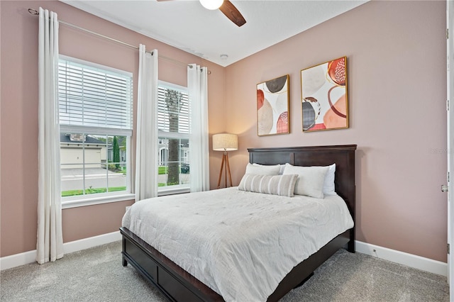 bedroom with light colored carpet and ceiling fan